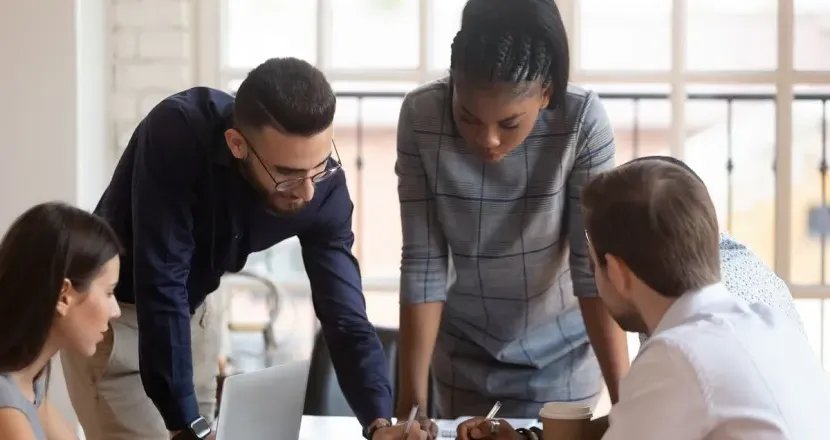 Business manager in meeting with co-workers