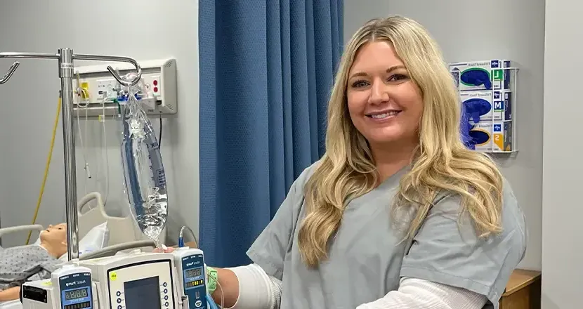 Smiling nurse with IV pump 